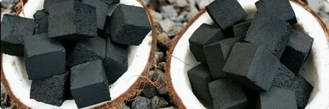 Coconut charcoal briquettes in coconut shells